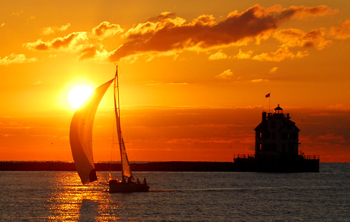 sunset ohio sky sun lighthouse lake sailboat boat lakeerie greatlakes lorain