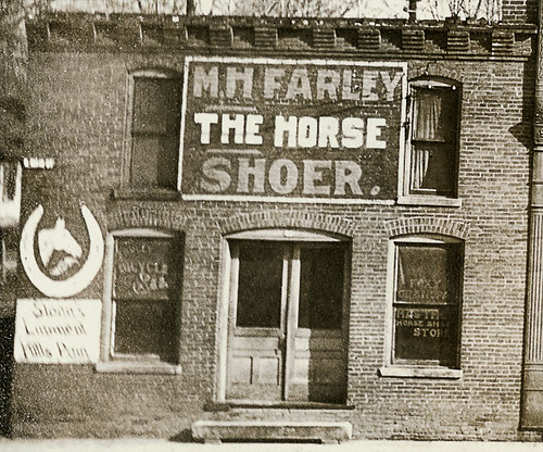 horses usa signs history sepia fence buildings advertising hardware indiana streetscene bicycles transportation shops storefronts sullivan buggy buggies businesses sullivancounty realphoto hoosierrecollections