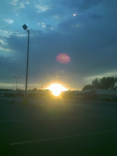 sunset sky clouds parkinglot lightpole stripmall