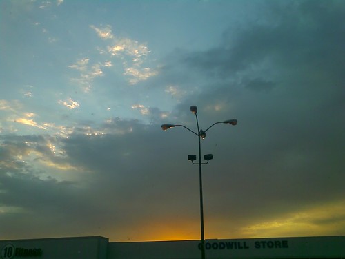 sunset sky clouds lightpole goodwill