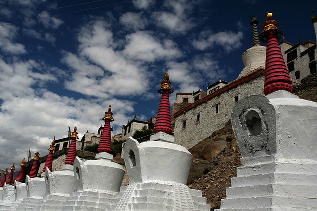 Thiksey Monastery behind a row of Chortens