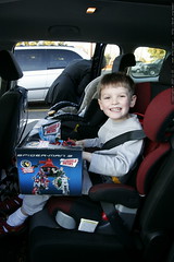 buckled in with the new toy in his lap    MG 6723 