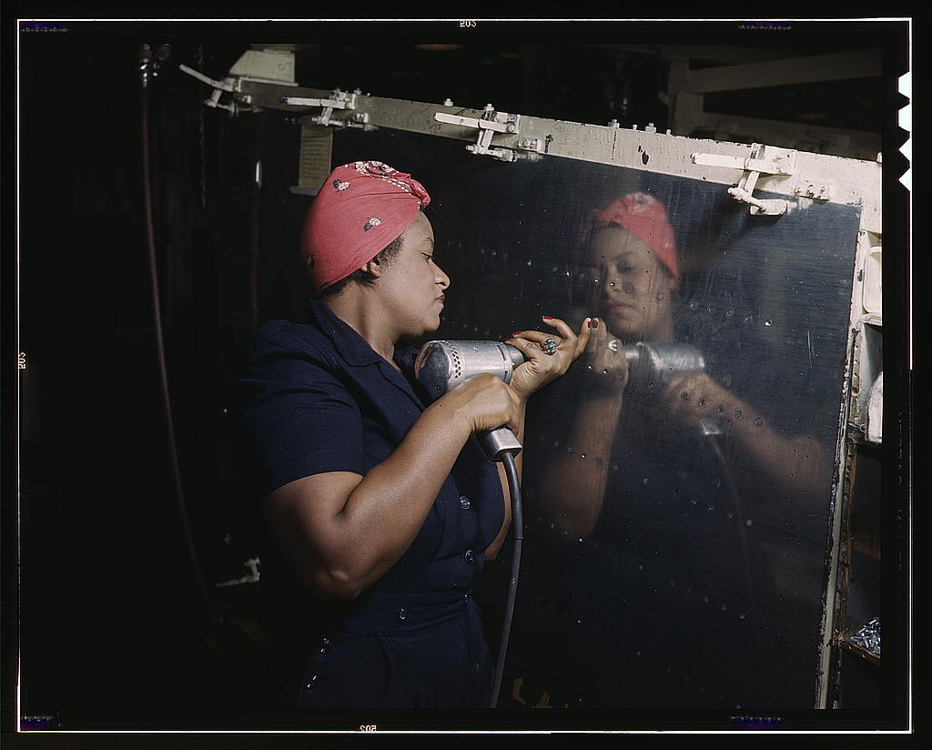 Operating a hand drill at Vultee-Nashville, woman is working on a "Vengeance" dive bomber, Tennessee  (LOC)