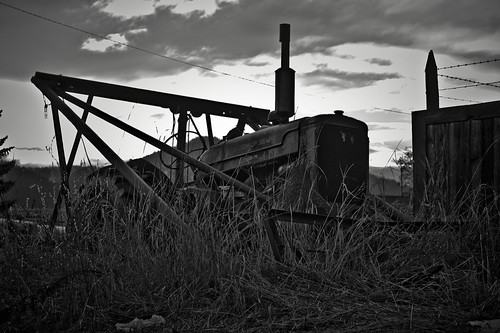 old morning light bw tractor mountains grass clouds sunrise fence blackwhite weeds sony plow canonfd fdmount canonfd50mmf18 chewelahwa nex3 fdnex