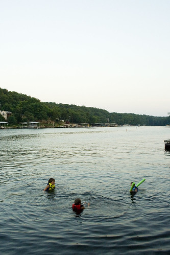 boy sunset lake water swimming dock dusk missouri nephews lakeoftheozarks lifejacket