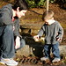 throwing pine cones into the storm drain    MG 2181