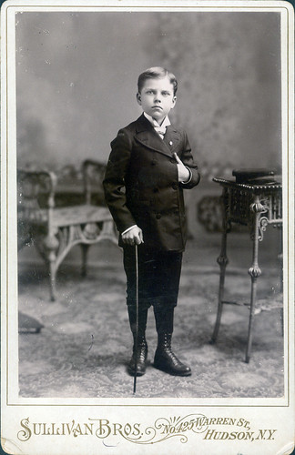 Boy in suit with cane
