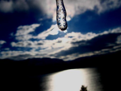 blue winter sky sun lake mountains macro ice water clouds icicle refractions