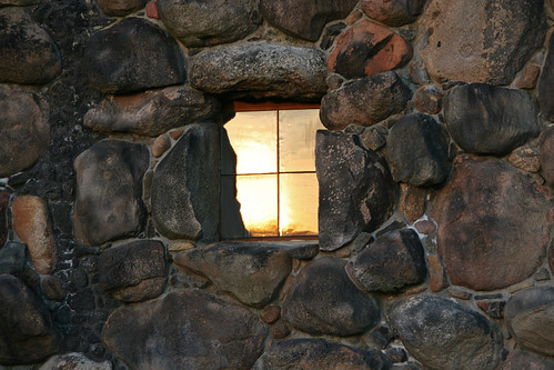 sunset sun reflection window wall stones