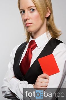 Businesswoman holding red card