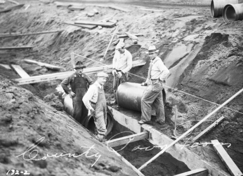 Laying pipe on county poor farm, 1933
