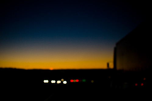 sunset blurry highway dusk headlights semi gloaming