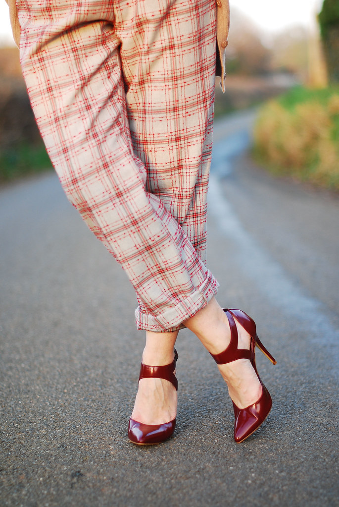 Check trousers, burgundy heels