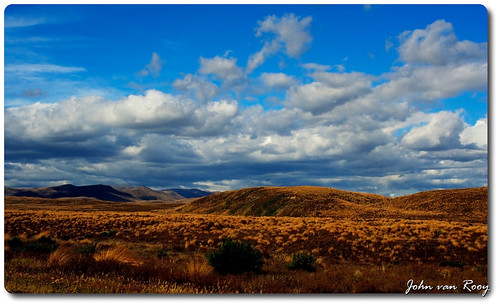 newzealand nature landscape bluesky canoneos350d tussock aotearoa desertroad cloudssky centralnorthisland copyright2009johnvanrooy