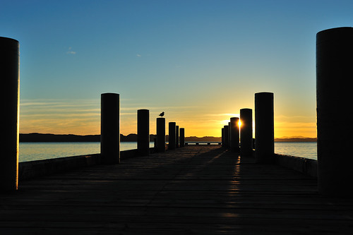 ocean blue newzealand sky orange sun water sunrise auckland wharf maraetai aotearoa
