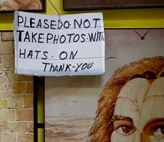 Please do not take photos with hats on