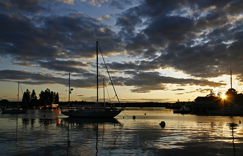 sunset sun reflection water clouds sailboat flag maine schooner boothbayharbor lazyjack magicalskies jasonneelyportfolio