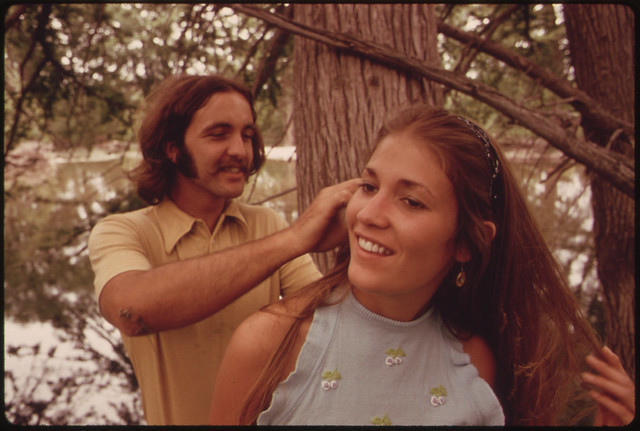 Young Man Picks Leaves from His Girl's Hair after They Had Embraced on the Banks of the Frio Canyon River near Leakey, Texas and San Antonio 05/1973