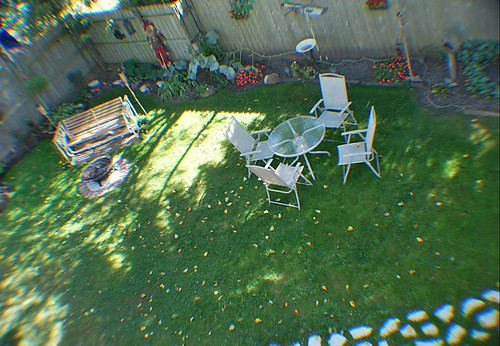 yard garden flowers plants steppingstones house lawn chairs fence