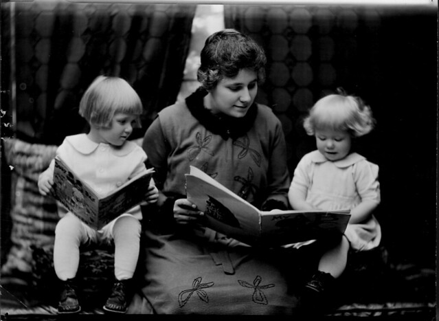 Student reading to two little girls. Photographed for 1920 home economics catalog by Troy. from Flickr via Wylio