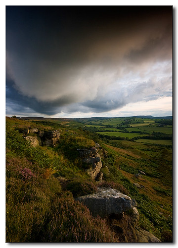 uk sunset england sky storm color colour green rain weather clouds canon shower colours britain patterns north east hills mel alnwick northumberland moors moor northeast corby crag cheviothills alnwickmoor eos400d canoneos400d northumberlandlandscapesgeotagged corbycrag shadowcreepr