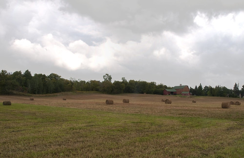 field clouds barn hay