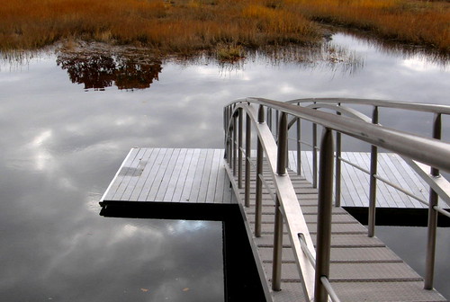 autumn sky fall water grass clouds silver reflections river gold dock aluminum steps maine foliage southportland longcreek