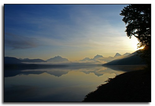 reflection silhouette sunrise montana glaciernationalpark lakemcdonald