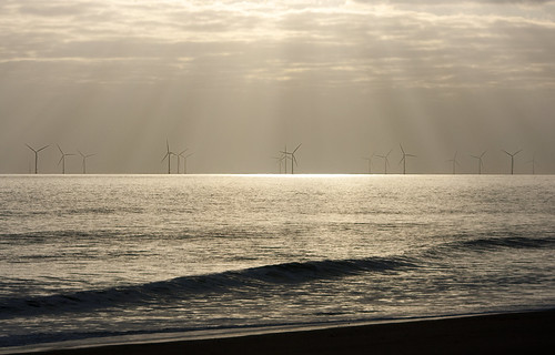 light sunset sea windmill sunrise coast energy waves sunbeam beams shimmer