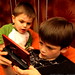sequoia watches nick playing lego batman on the nintendo DS