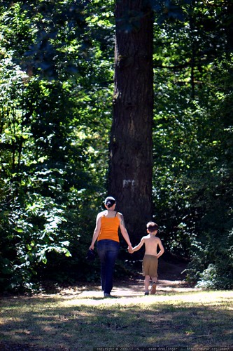 rachel and nick walk hand in hand into the forest    MG 8310