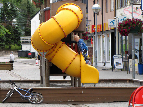 city boy playing bike playground yellow norway photography town interesting scenery village view tube picture arctic stadt nordic scandinavia northern stad finnmark kirkenes northcape nordkap nordkapp kirkenäs