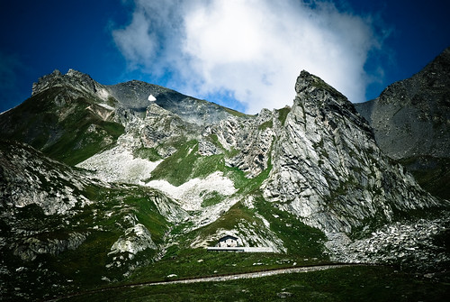 road blue sky italy house mountains alps green grass clouds alpes landscape grey switzerland italia view suisse saintbernard col montagnes sanbernardo coldugrandstbernard grandsaintbernard coldugrandsaintbernard