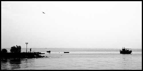 sea sky bw white man black bird water boat bush seagull gull horizon greece lamppost thessaloniki ernest hemingway karamanis
