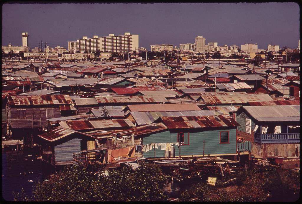 Modern Buildings Tower over the Shanties Crowded Along the Martin Pena Canal 02/1973