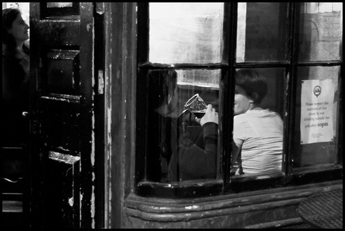Couple sat at window of pub
