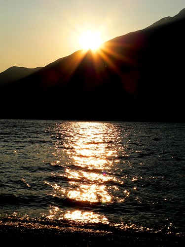 morning summer italy sun lake reflection beach sunrise garda italia waves wave reflect shore rise limone sul