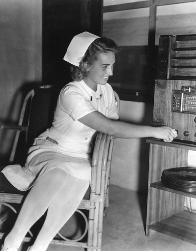Nurse listening to a radio during World War II