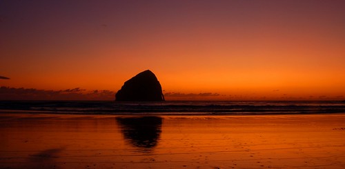 ocean sunset reflection silhouette rock stone oregon pacific haystackrock monolith pacificcity capekiwanda platinumheartaward