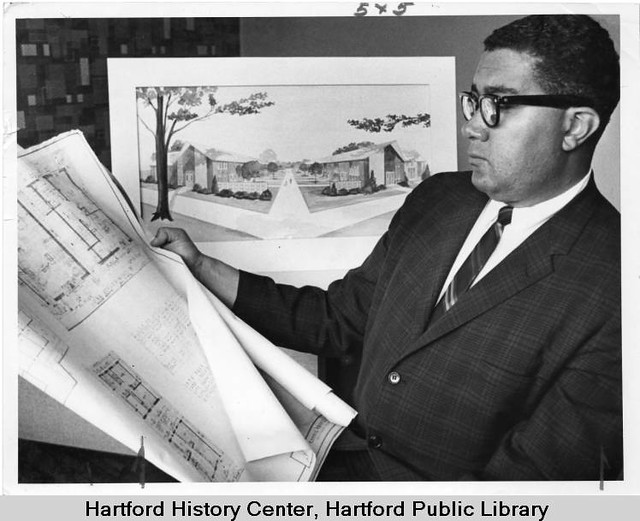 Allen Hodge Davis reviewing house blueprints, Hartford, 1963