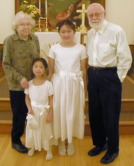 Mom, Dad, and Girls at First Communion
