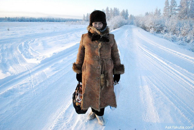 A lady returning from Oymyakon's store. 7 km to go further.