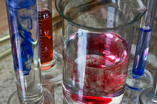 Red and blue substances in transparent test tubes