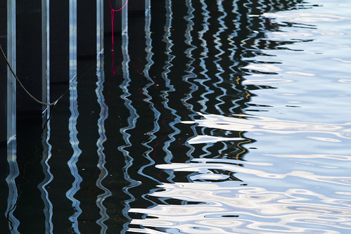 water sea ocean harbor reflection reflect dock pilings coast coastal seacoast winter offseason abstract saltwater blue pier wharf