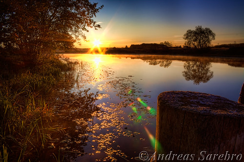 autumn sky sun tree sol water sunrise river weed sweden hdr bollard arboga