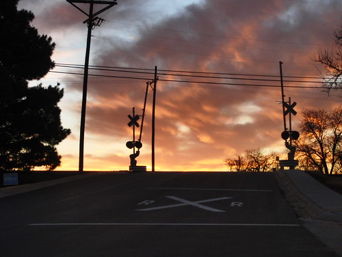 railroad clouds sunrise crossing gates signal