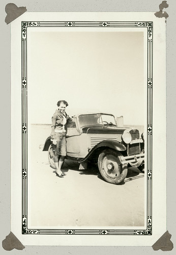 Woman standing by car