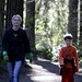 mother and son walking in the woods