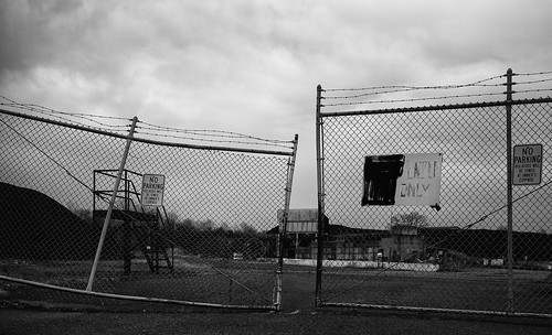factory abandoned landscape decay industrial barbedwire gate bw ruin asphalt fence southbrunswicktownship newjersey unitedstates us