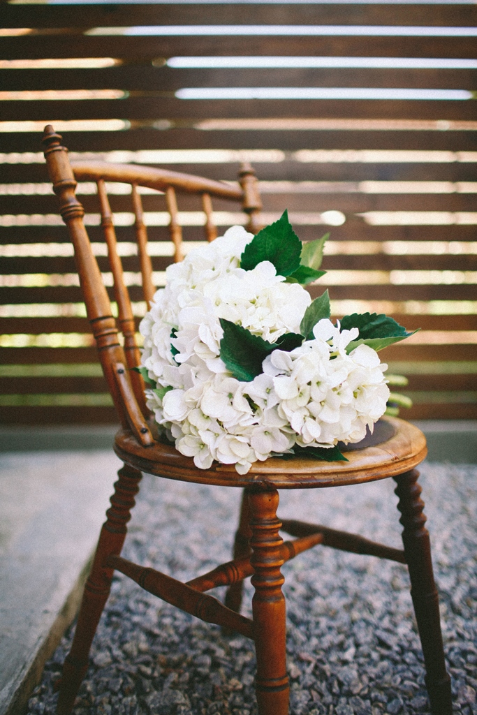Faux hydrangea bouquet on vintage chair